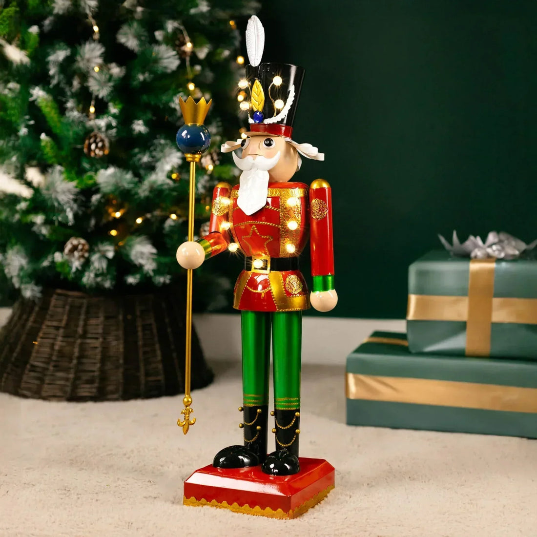 Miniture christmas nutcracker with a christmas tree and presents in the background