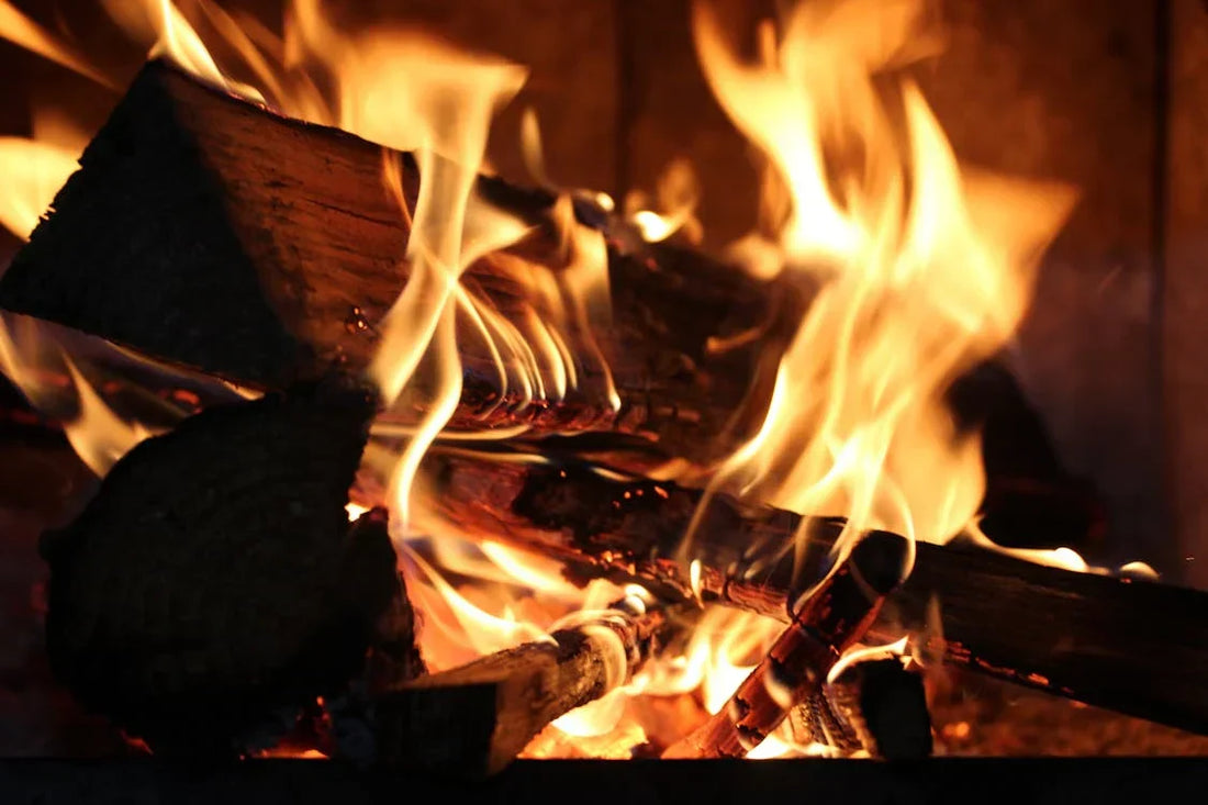 Close up of a fireplace with flames burning
