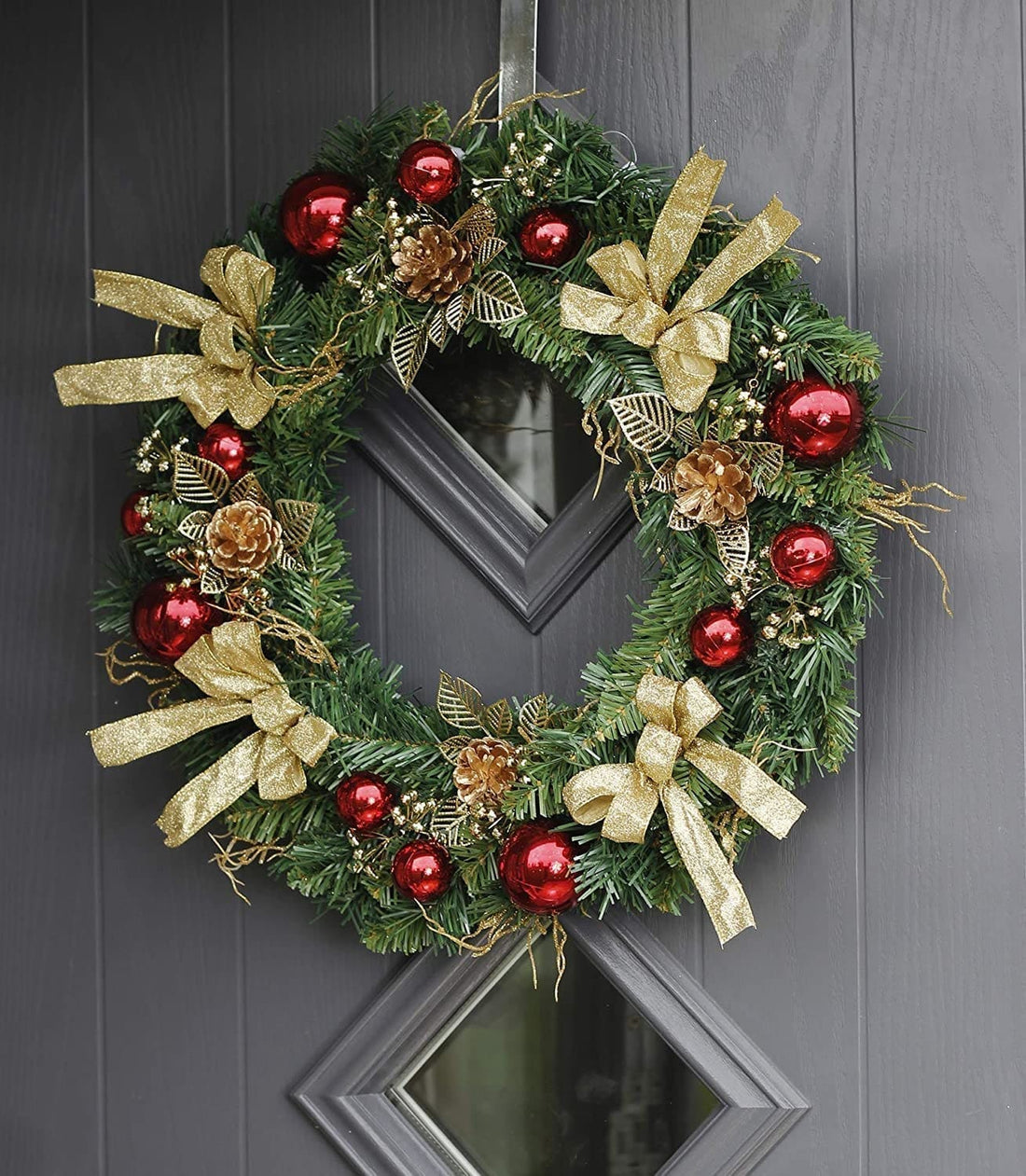 Christmas door wreath on a grey door