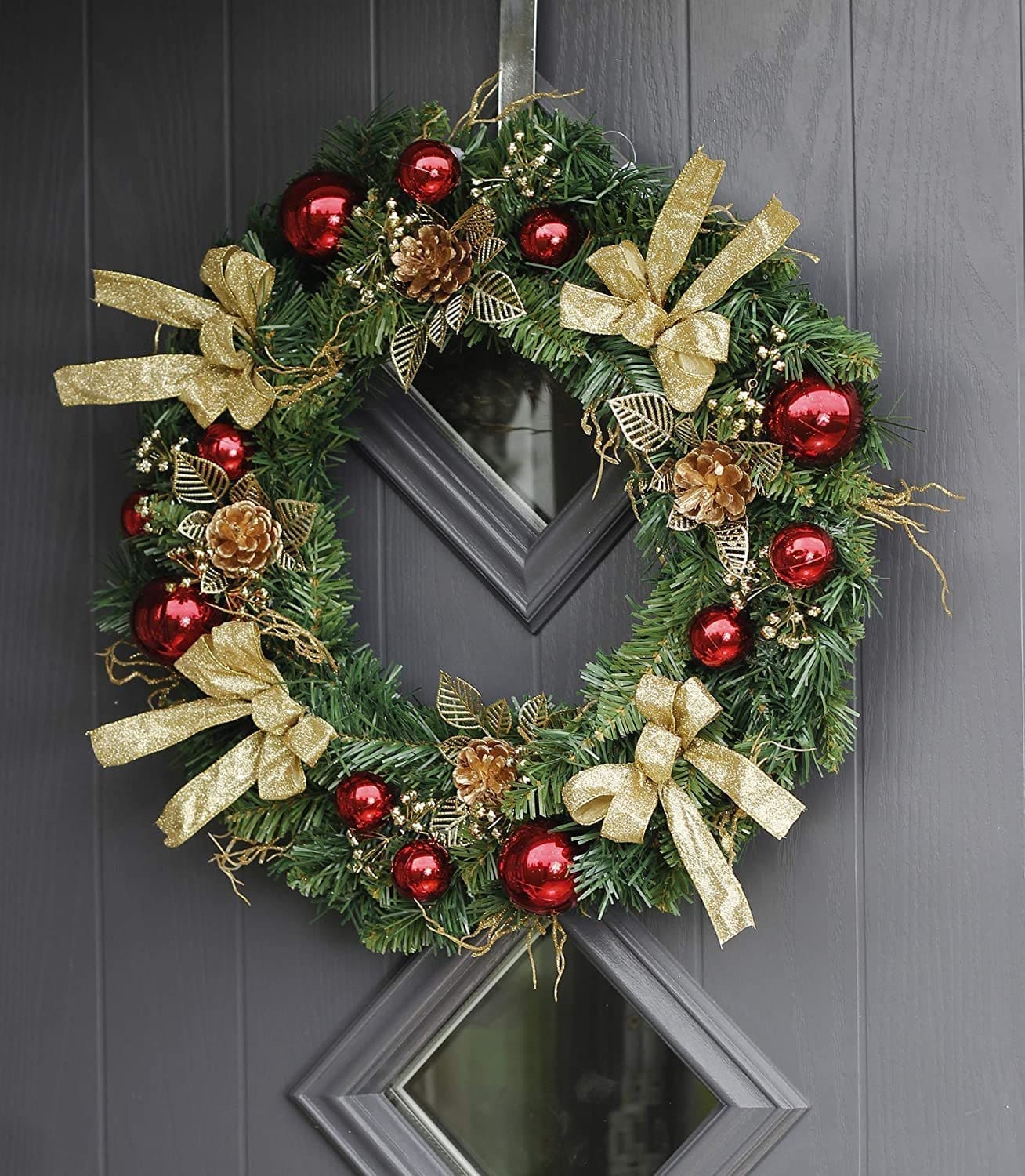 Christmas door wreath on a grey door