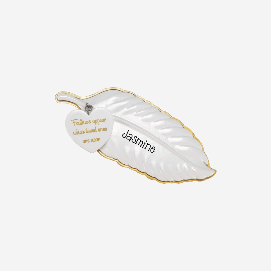 Decorative leaf-shaped dish with 'Jasmine' and motivational quote on a white background