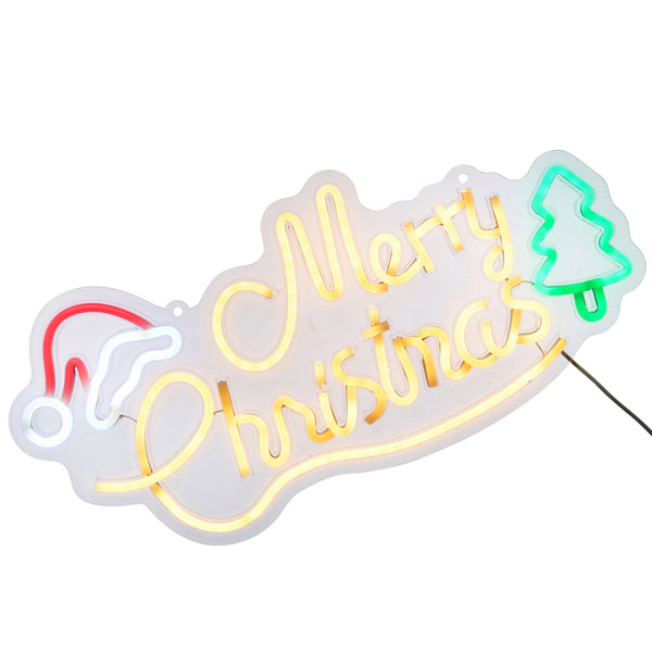 A Christmas-themed LED neon sign with 'Merry Christmas' in glowing yellow script, a red and white Santa hat on the left, and a green Christmas tree on the right, set against a plain white background.