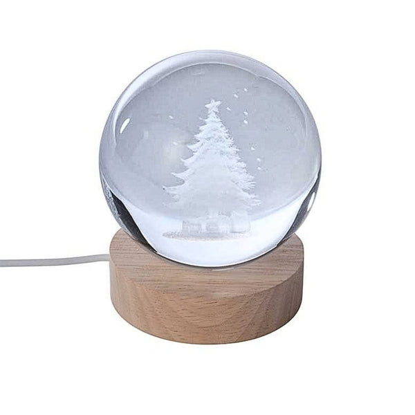Clear glass crystal ball light with etched Christmas tree design, natural wooden base and USB power cable on a white background.