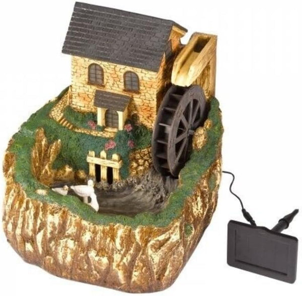 A miniature water mill garden ornament with a stone-textured house, large water wheel, small waterfall, and a black power adapter on a white background.