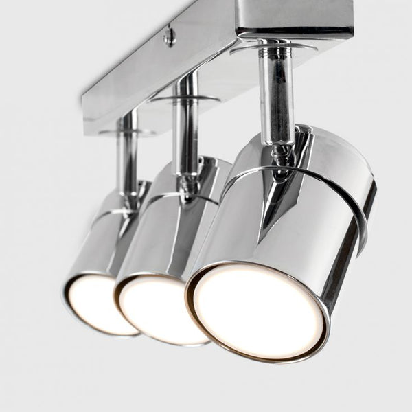 Chrome ceiling light fixture with three cylindrical lights on a white background