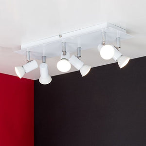 Ceiling light fixture with white lights on a red and black wall background