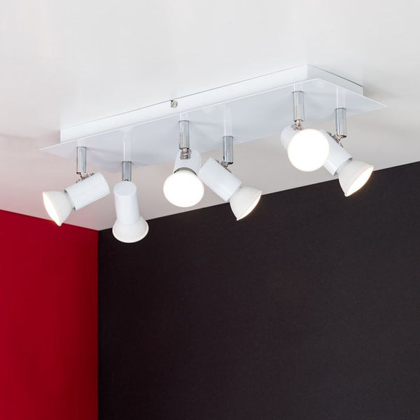 Ceiling light fixture with white lights on a red and black wall background