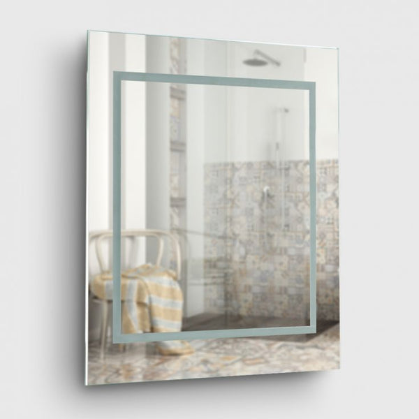 Rectangular mirror with a decorative frame on a white wall
