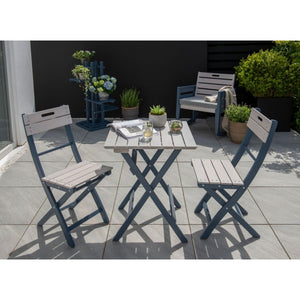 Outdoor patio set with table and chairs on a tiled patio