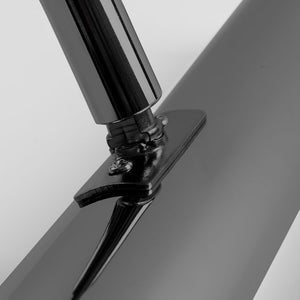 Close-up of a black propeller on a gray background