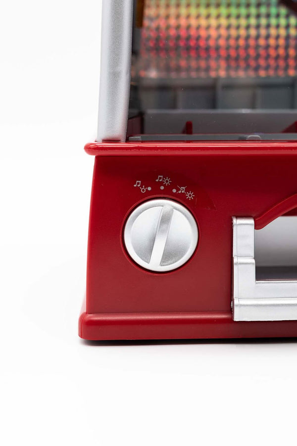 Red hot dog grill with a control knob on a white background