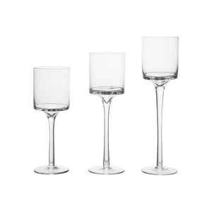 Three clear glass stemware pieces with different bowl and stem designs, arranged side by side on a plain white background.