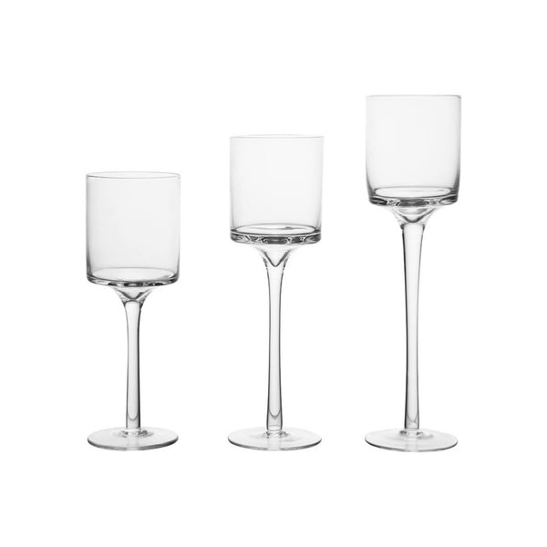 Three clear glass stemware pieces with different bowl and stem designs, arranged side by side on a plain white background.