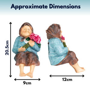 A product dimension graphic showing a small seated figurine from front and side views with arrows and text reading 'Approximate Dimensions' and measurements 20.5 cm tall, 9 cm wide, and 12 cm deep.