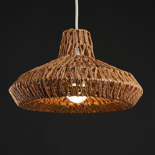 Woven pendant light on a black background