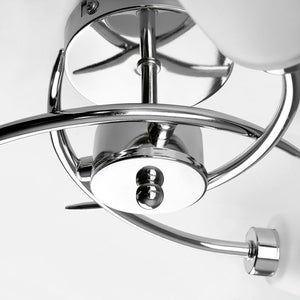 Close-up of a chrome ceiling fan on a white background