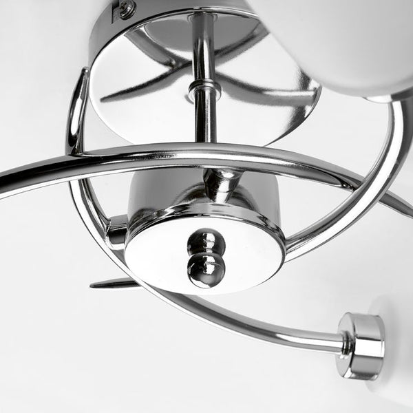 Close-up of a chrome ceiling fan on a white background