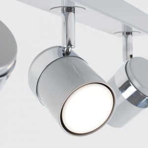 Chrome ceiling light fixture with three cylindrical lights on a white background
