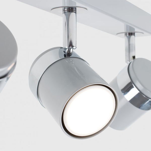 Chrome ceiling light fixture with three cylindrical lights on a white background