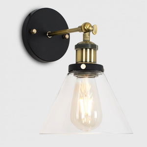 Wall-mounted light fixture with black and gold design on a white background