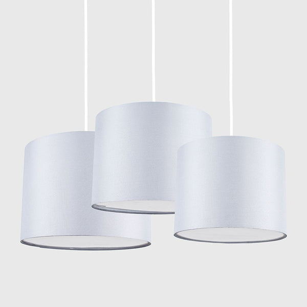 Three white pendant lights on a white background