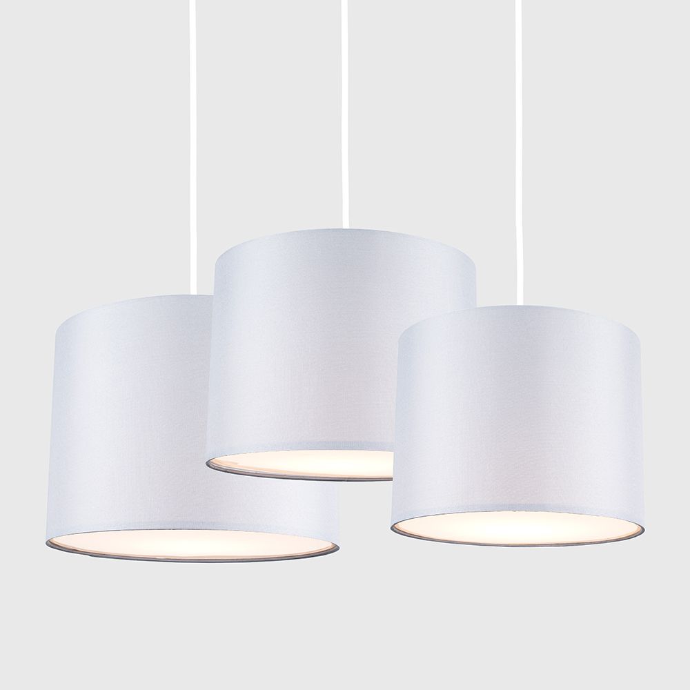 Three white pendant lights on a white background