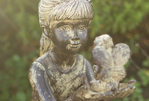 23cm fairy garden ornament displayed amongst flowers