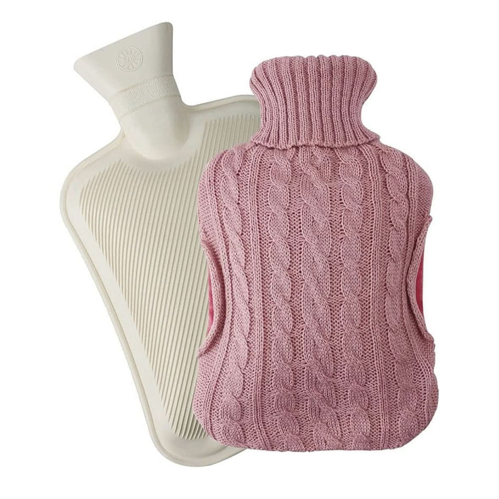 Person holding a pink knitted hot water bottle against a white background