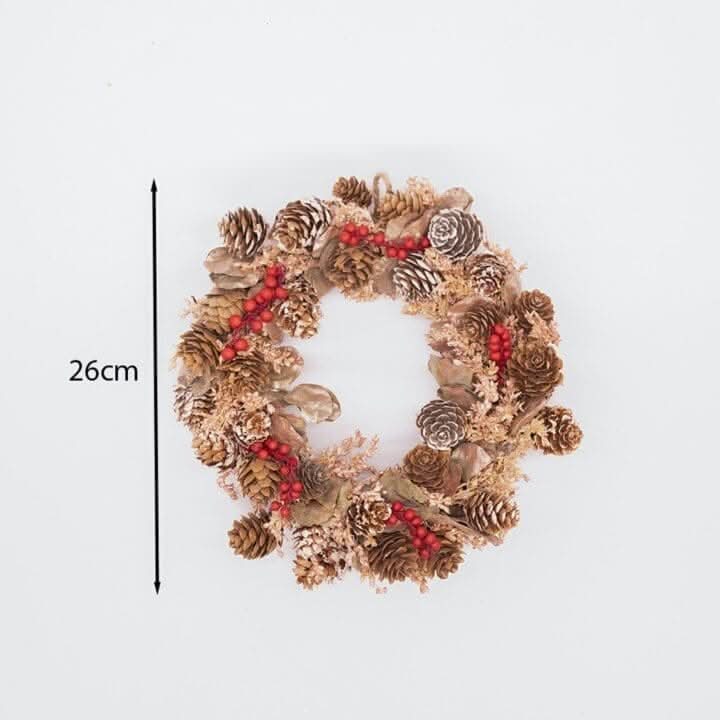 Red berry scented Christmas wreath hanging on a door