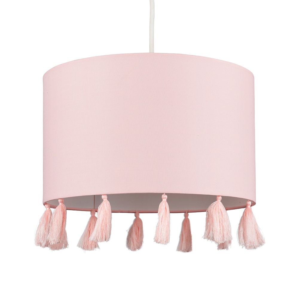 Pink lampshade with tassels on a gray background