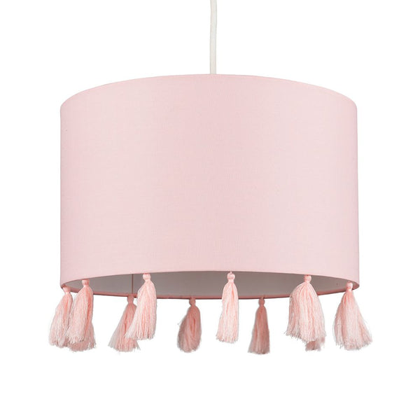 Pink lampshade with tassels on a white background