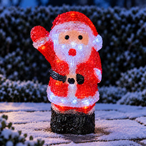 inlit santa decoration in a snowy wintery scene