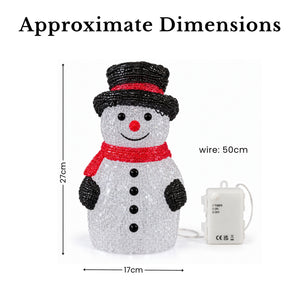 A snowman-shaped LED light with approximate dimensions shown on a white background, including a height of 27cm, width of 17cm, and wire length of 50cm. The product has a white glittery body, black hat and buttons, and red scarf and nose.