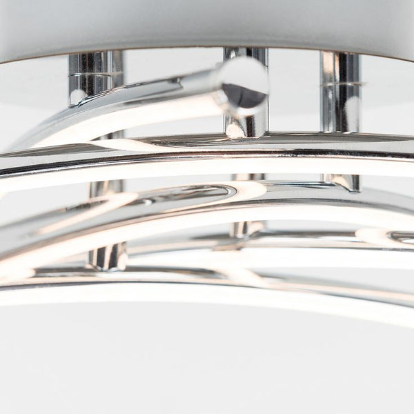 Close-up of a modern ceiling light fixture with chrome finish