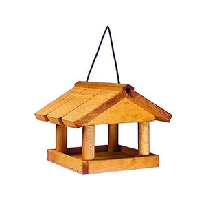 Wooden bird seed feeder with traditional hut style roof