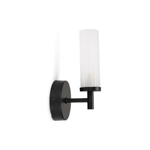 Black wall sconce with a white candle-style light on a white background