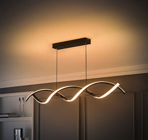 Modern ceiling light fixture with wavy design in a room setting