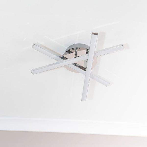 Modern ceiling light fixture with chrome finish on a white background