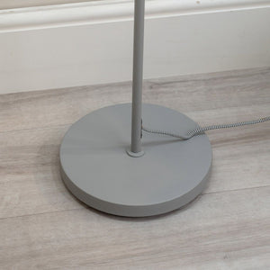Gray floor lamp base on a wooden floor