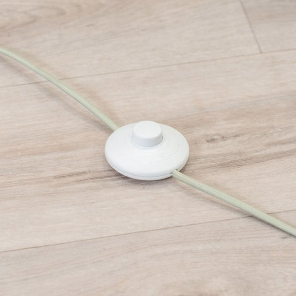 White cable tie on a wooden floor