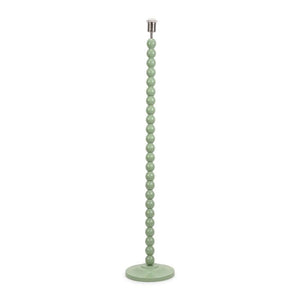 Green beaded floor lamp on a white background