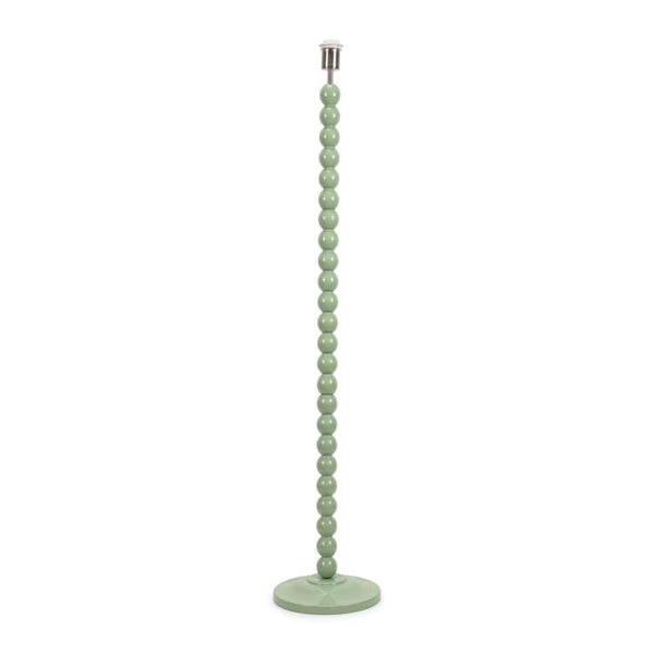 Green beaded floor lamp on a white background