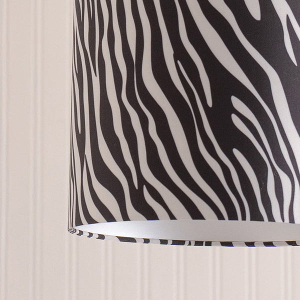 Zebra patterned blind against a neutral wall