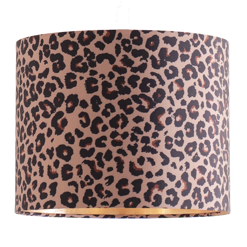 Leopard print lampshade hanging against a striped wall.