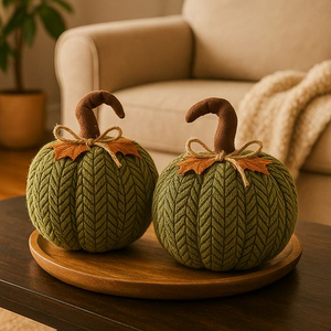 Two large handcrafted plush pumpkins