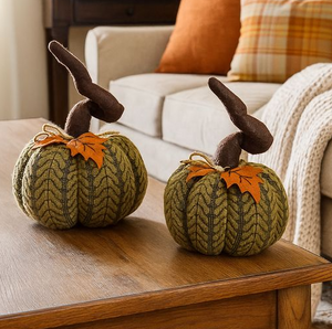Two medium handcrafted plush pumpkins