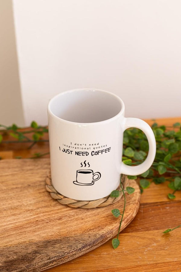 Four motivational mugs displayed together