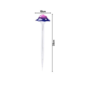 Solar powered mushroom ornament positioned among garden plants