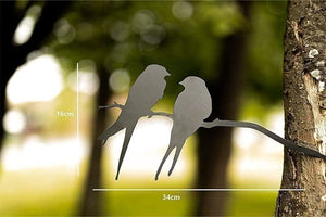 Metal love birds decoration mounted on tree