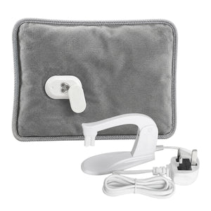 A gray heated pad with a white control switch, shown with its white power cord and plug on a plain white background.